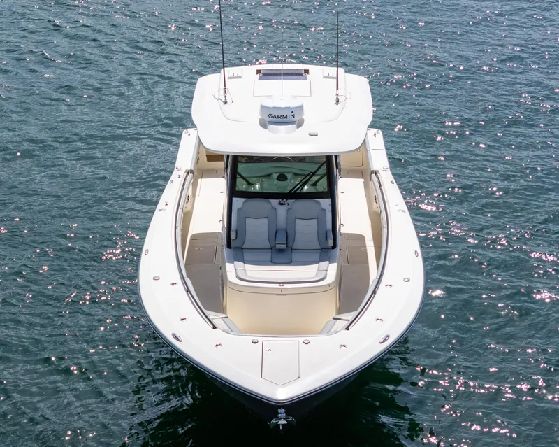 Slide: The Image of 2020 Scout 380 LXF boat on water, aerial view, sunny day. - 17