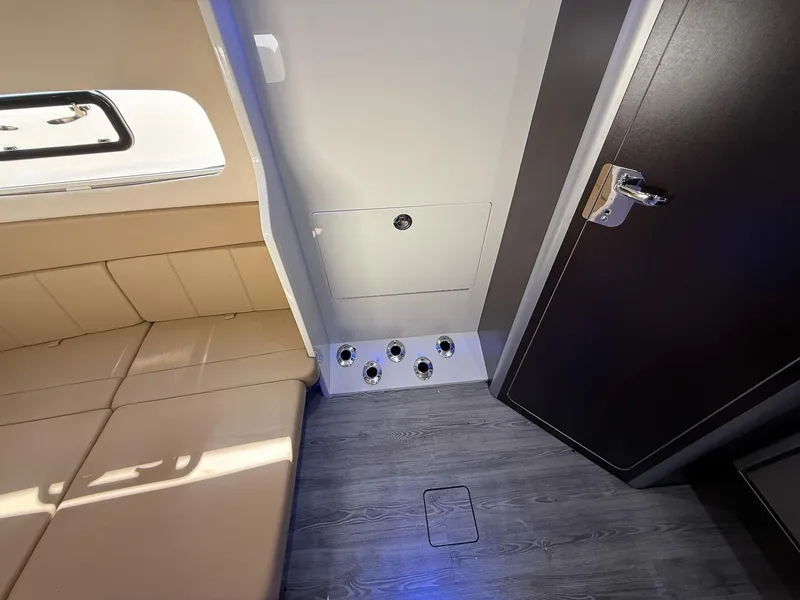 Slide: The Image of Interior of 2020 Scout 380 LXF boat with seating and storage compartment. - 31