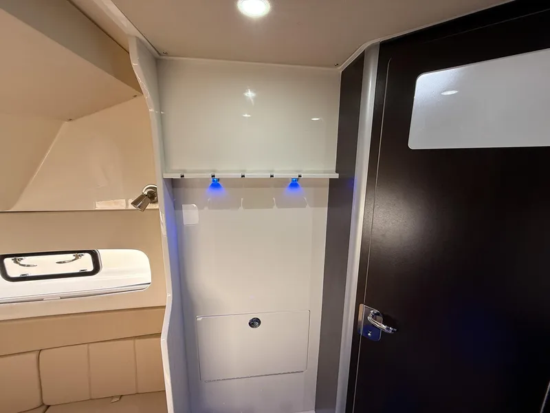 Slide: The Image of Interior of 2020 Scout 380 LXF boat, featuring modern design and ambient lighting. - 32