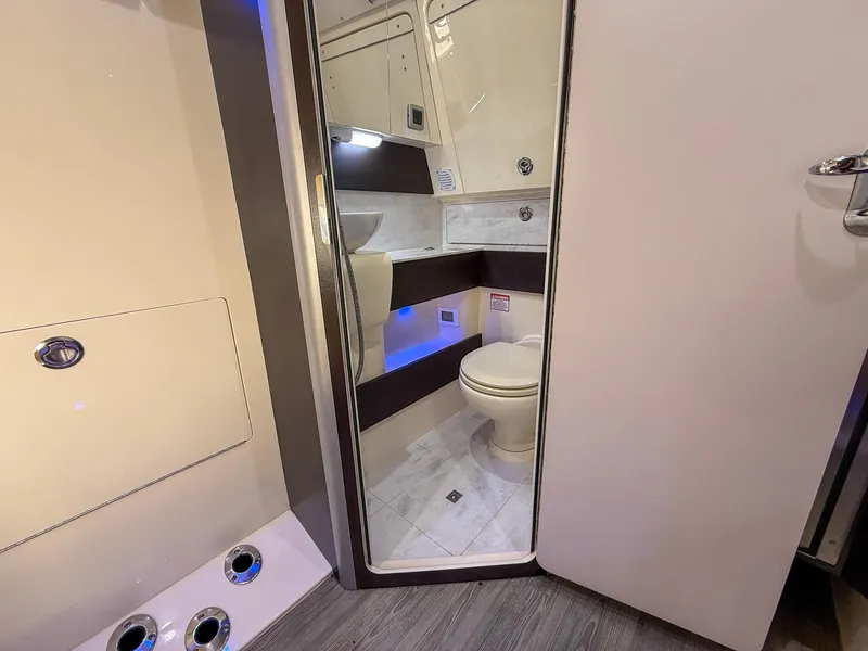 Slide: The Image of 2020 Scout 380 LXF boat interior bathroom with modern fixtures and sleek design. - 33