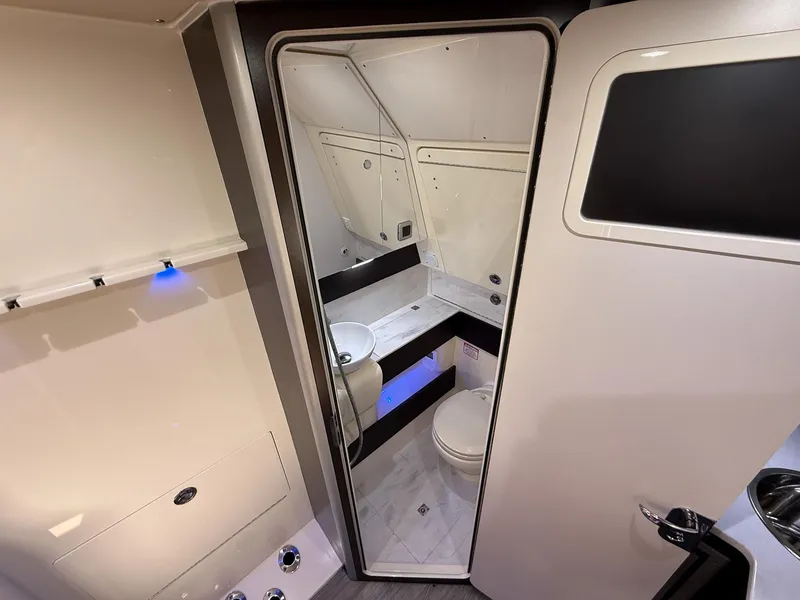 Slide: The Image of 2020 Scout 380 LXF boat bathroom interior with modern fixtures and sleek design. - 34