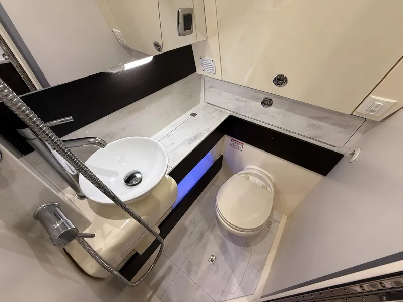 Slide: The Image of 2020 Scout 380 LXF boat bathroom with modern sink, toilet, and sleek design. - 35