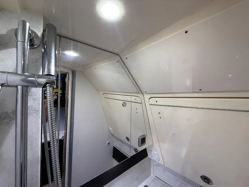 Slide: The Image of Interior of 2020 Scout 380 LXF boat, featuring modern shower and sleek design. - 36