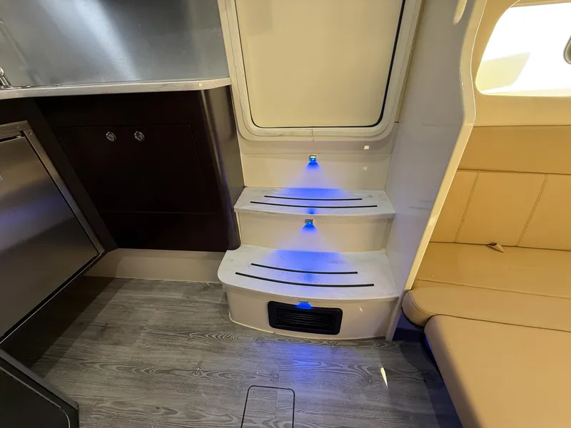 Slide: The Image of Interior of 2020 Scout 380 LXF boat with illuminated steps and modern seating. - 37