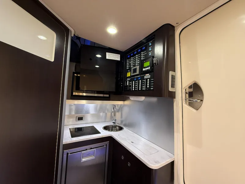 Slide: The Image of 2020 Scout 380 LXF interior with kitchenette, control panel, and modern amenities. - 39