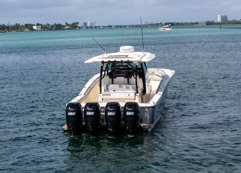 Slide: The Image of 2020 Scout 380 LXF boat with four engines on open water. - 8