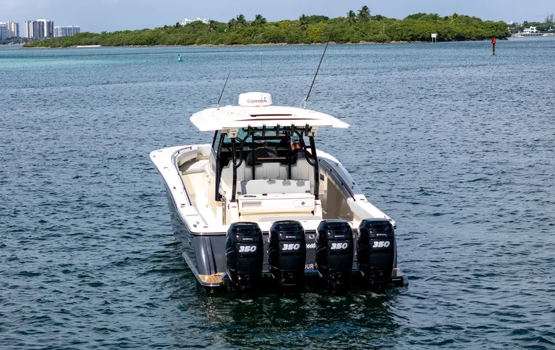 Slide: The Image of 2020 Scout 380 LXF boat with four engines on open water. - 9