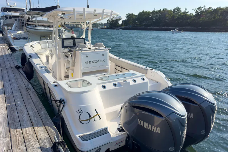 Slide: The Image of 2022 Sea Fox 288 Commander boat docked with twin Yamaha engines. - 15