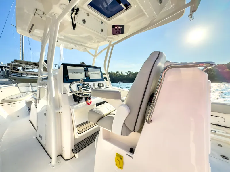 Slide: The Image of 2022 Sea Fox 288 Commander boat interior with dual Garmin displays and helm station. - 26