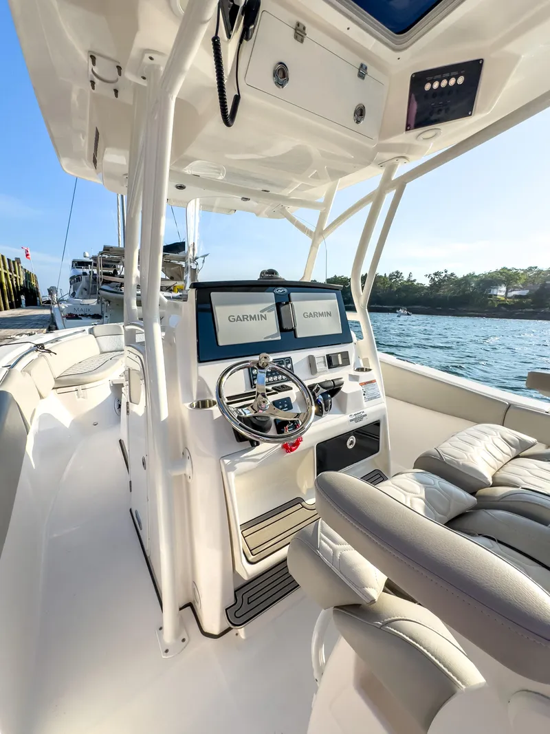 Slide: The Image of 2022 Sea Fox 288 Commander boat interior with dual Garmin displays and steering wheel. - 27