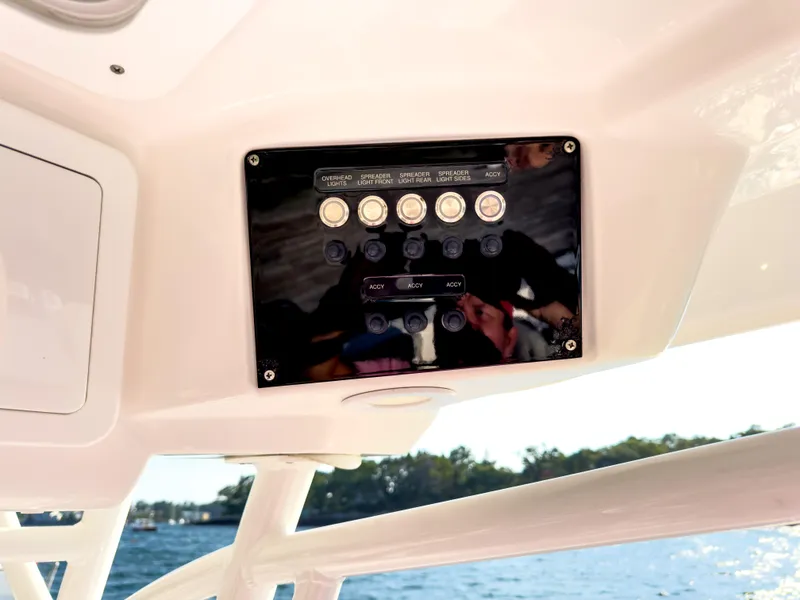 Slide: The Image of Control panel on a 2022 Sea Fox 288 Commander boat, overlooking water. - 31