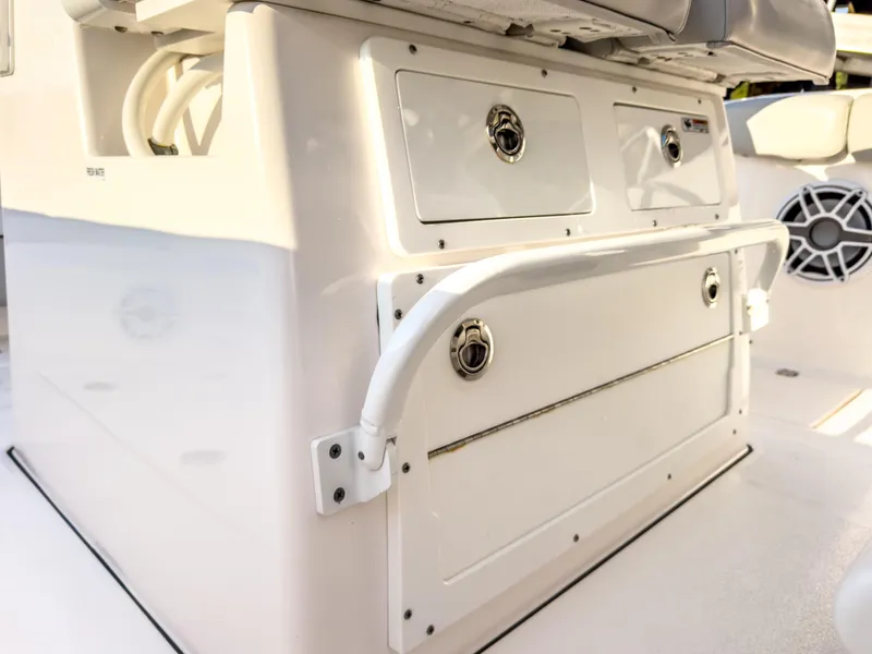 Slide: The Image of 2022 Sea Fox 288 Commander boat storage compartments and seating area. - 32