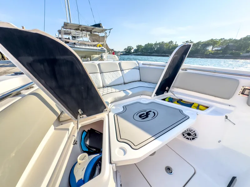 Slide: The Image of 2022 Sea Fox 288 Commander boat interior with open storage compartments and seating. - 39
