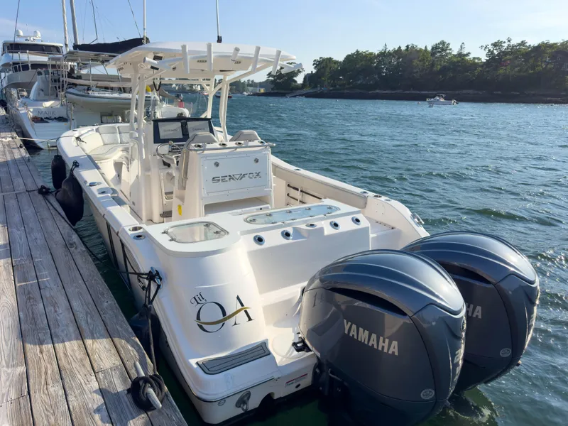 Slide: The Image of 2022 Sea Fox 288 Commander boat docked with twin Yamaha engines. - 4
