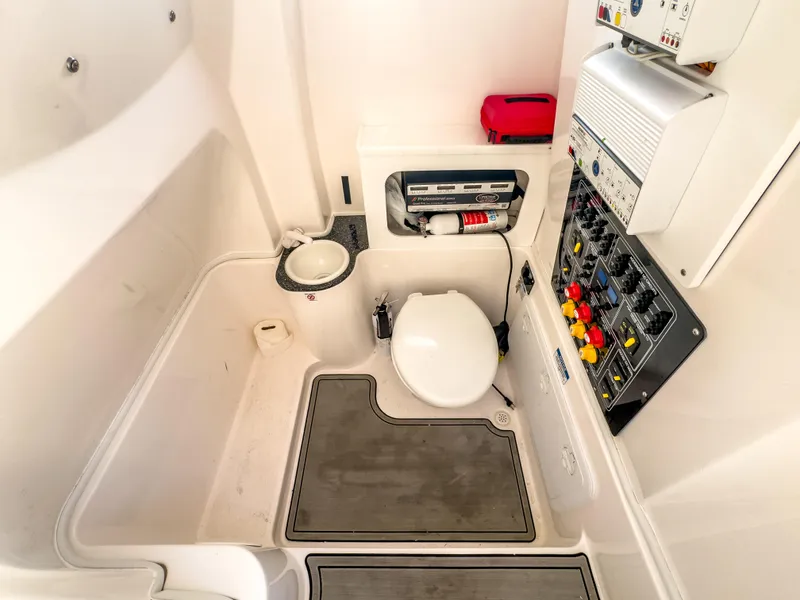 Slide: The Image of 2022 Sea Fox 288 Commander interior with toilet, sink, and control panel. - 42