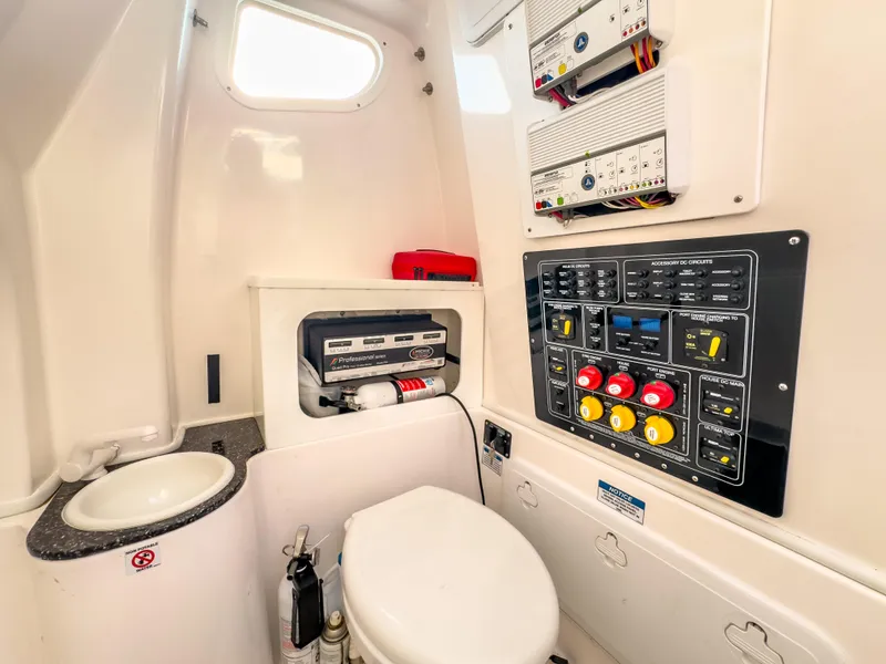 Slide: The Image of 2022 Sea Fox 288 Commander boat interior with control panel and compact bathroom. - 43