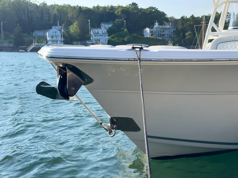 Slide: The Image of 2022 Sea Fox 288 Commander boat anchored near scenic shoreline. - 9