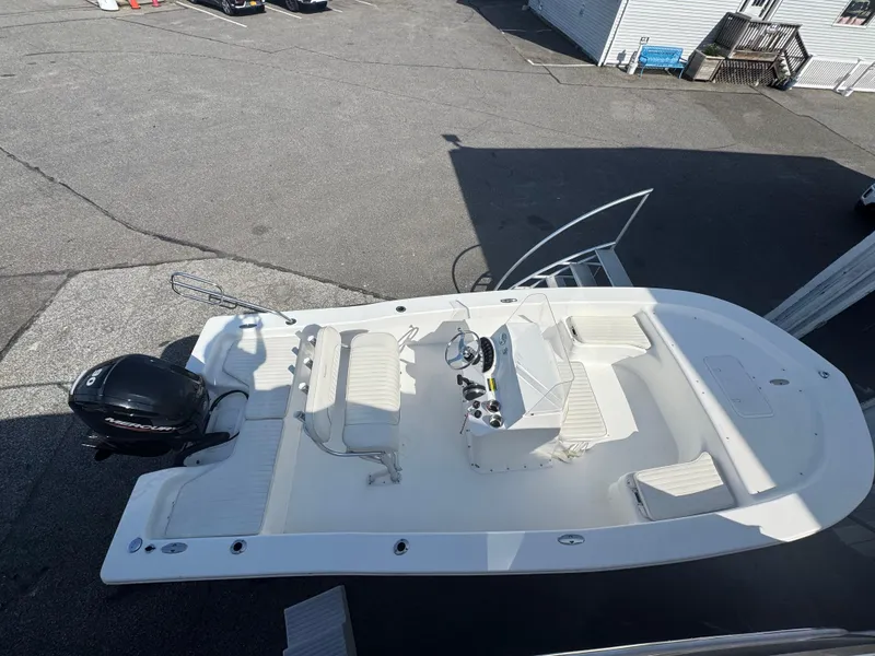 Slide: The Image of 2021 Savannah SS19 boat interior, featuring sleek white deck and seating. - 11