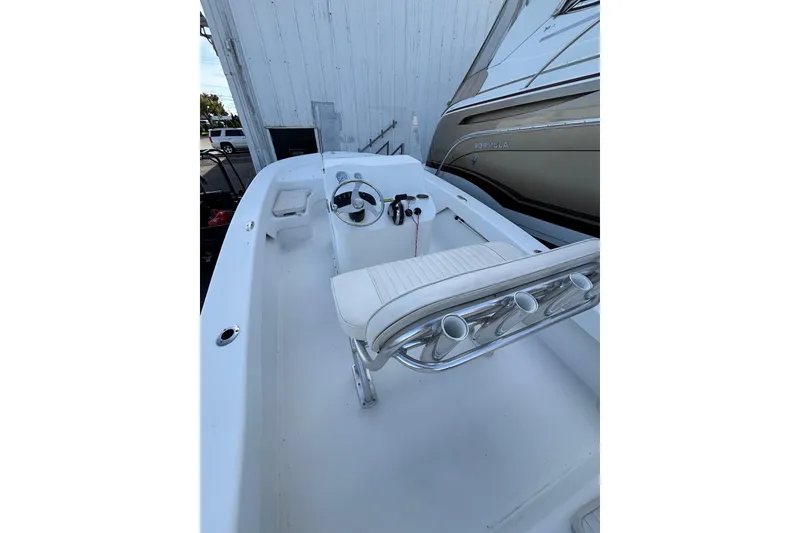 Slide: The Image of 2021 Savannah SS19 boat interior with steering wheel and seating. - 14