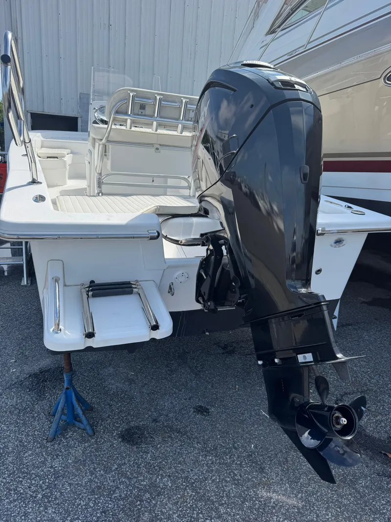 Slide: The Image of 2021 Savannah SS19 boat interior with steering console and cushioned seating. - 9