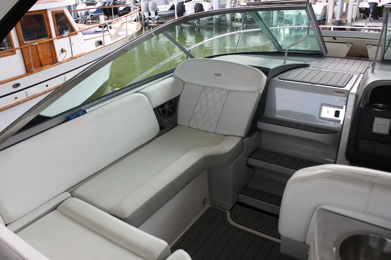 Slide: The Image of 2021 Regal 33 XO boat interior with white seating and modern design. - 18