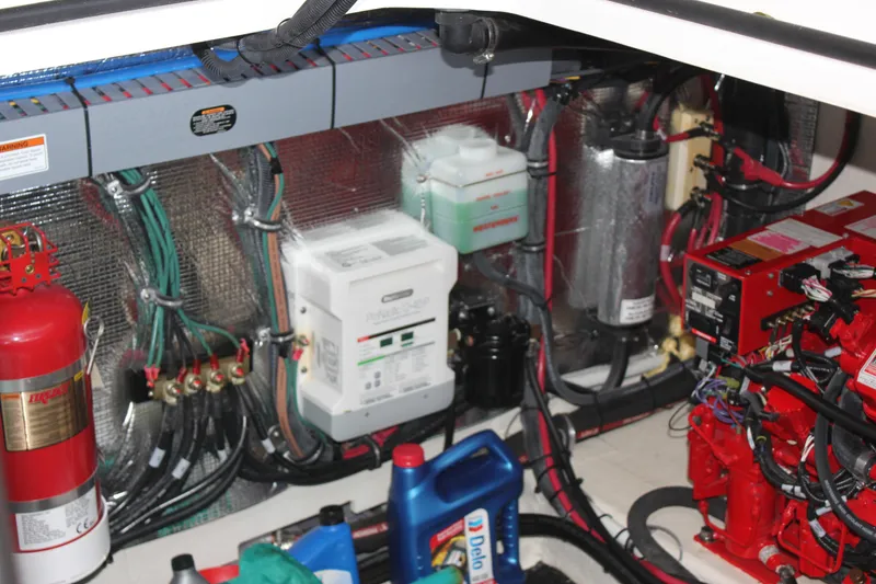 Slide: The Image of Engine compartment of a 2021 Regal 33 XO boat with wiring and equipment. - 32