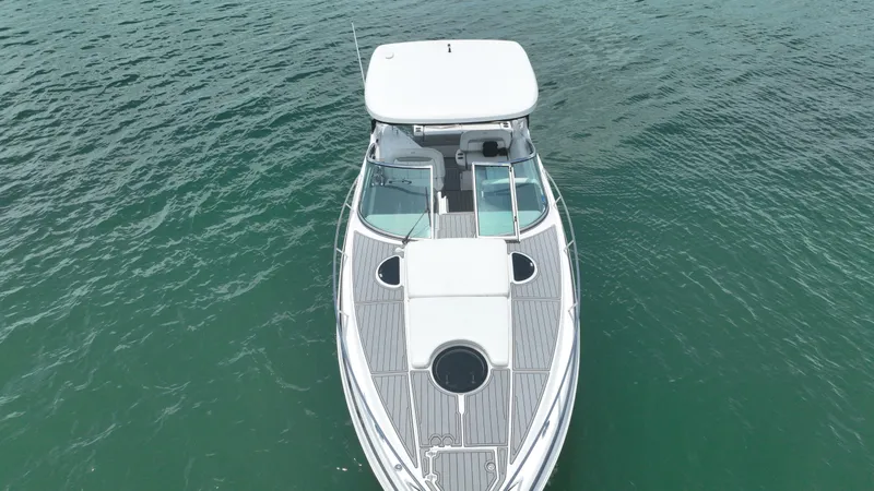 Slide: The Image of 2021 Regal 33 XO boat on calm water, aerial view. - 6