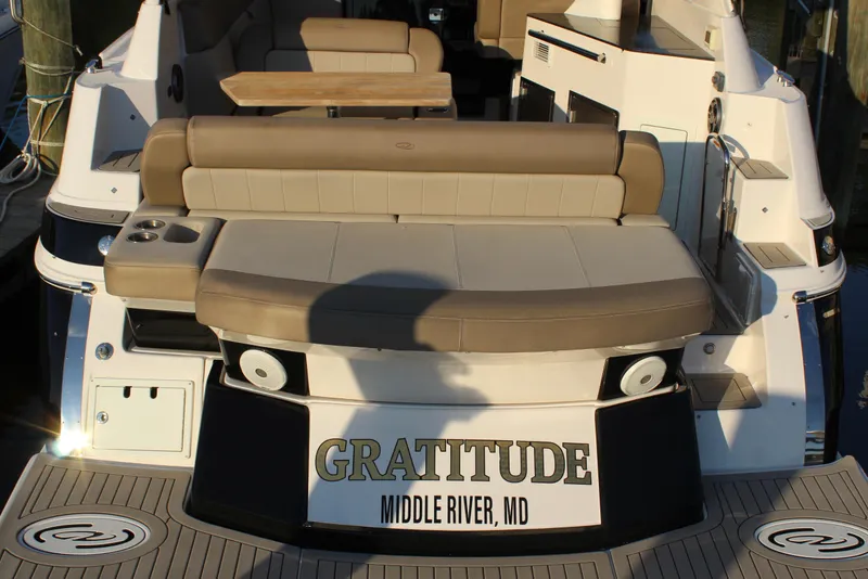 Slide: The Image of 2015 Regal 35 Sport Coupe boat with seating, docked at Middle River, MD. - 23