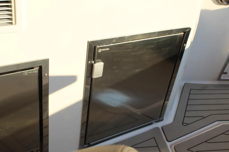 Slide: The Image of 2015 Regal 35 Sport Coupe interior with stainless steel fridge doors. - 34