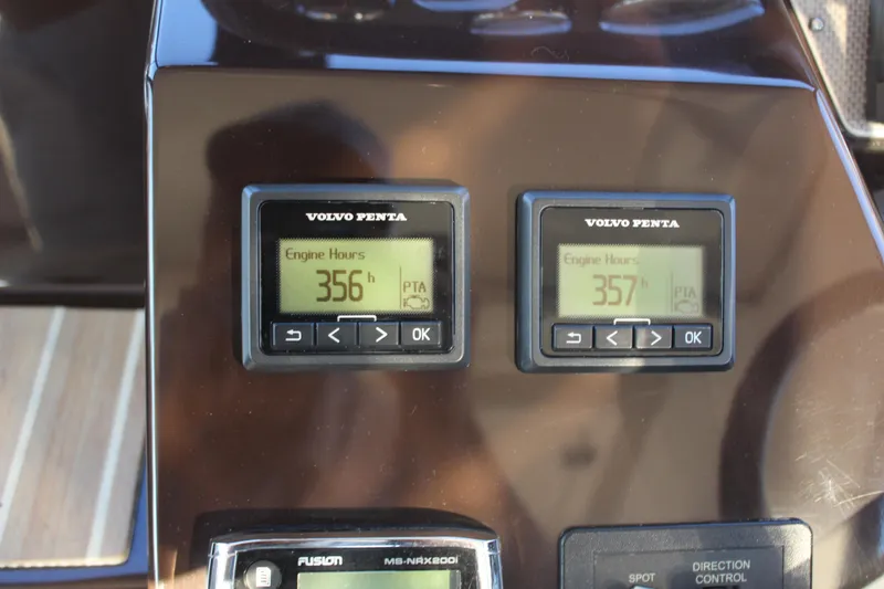 Slide: The Image of Volvo Penta engine hour meters on 2015 Regal 35 Sport Coupe dashboard, showing 356 and 357 hours. - 40