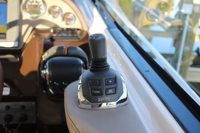 Slide: The Image of Joystick control on 2015 Regal 35 Sport Coupe dashboard, featuring navigation instruments. - 42