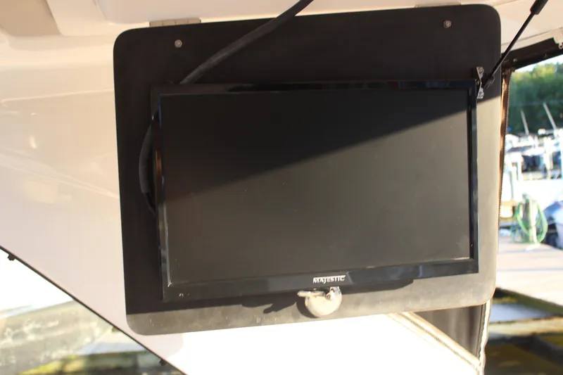Slide: The Image of Flat screen TV mounted on a 2015 Regal 35 Sport Coupe boat. - 48