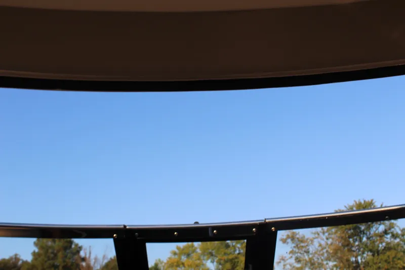 Slide: The Image of View from Regal 35 Sport Coupe 2015, showcasing clear blue sky and trees. - 49