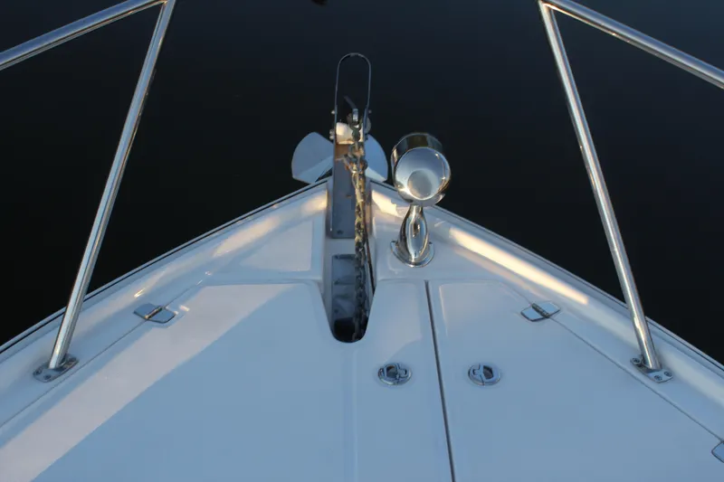 Slide: The Image of Bow view of 2015 Regal 35 Sport Coupe boat with anchor and spotlight. - 51