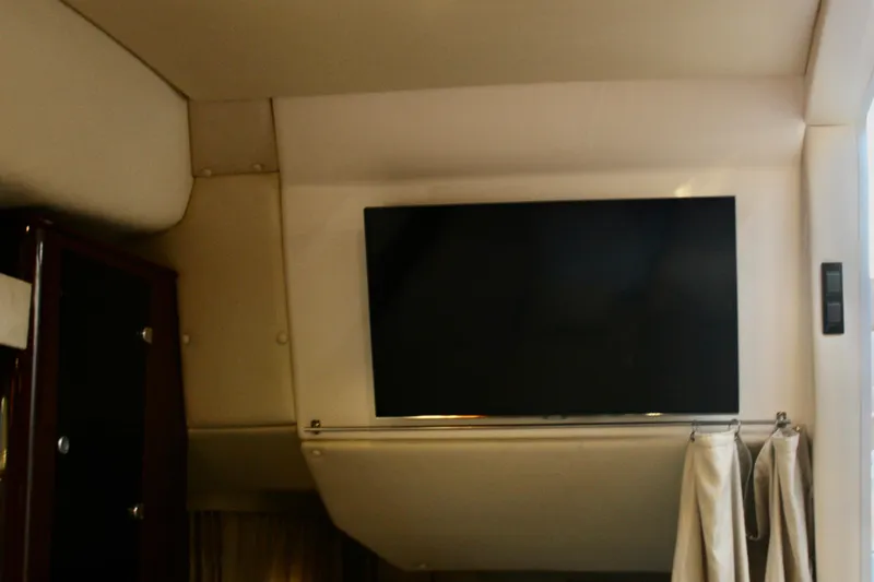 Slide: The Image of Interior of 2015 Regal 35 Sport Coupe with mounted flat-screen TV. - 56