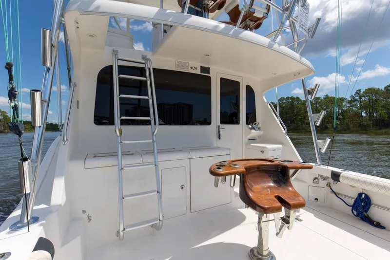 Slide: The Image of 2005 Cabo 40 Flybridge yacht with ladder and fishing chair on deck. - 10
