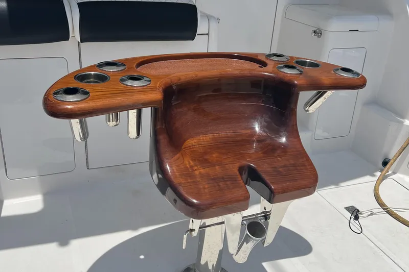 Slide: The Image of Luxurious wooden fishing rod holder on 2005 Cabo 40 Flybridge yacht deck. - 14