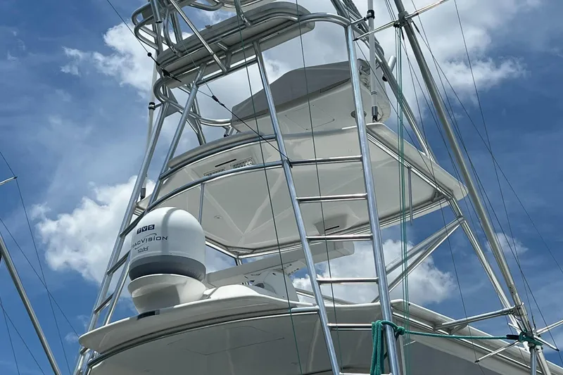 Slide: The Image of 2005 Cabo 40 Flybridge with radar equipment against a blue sky. - 19