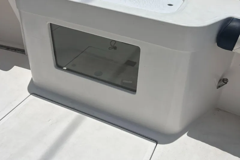 Slide: The Image of 2005 Cabo 40 Flybridge boat interior detail with storage compartment. - 30