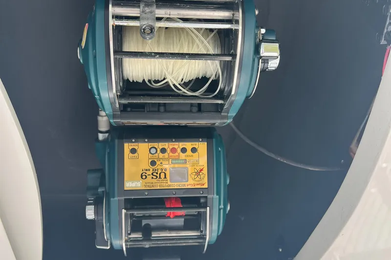 Slide: The Image of Fishing reel equipment on a 2005 Cabo 40 Flybridge boat. - 31