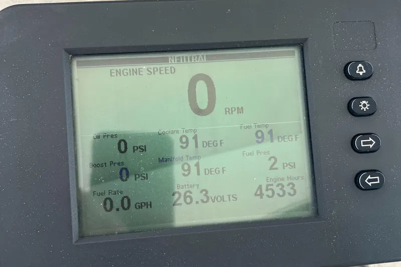 Slide: The Image of Display panel of a 2005 Cabo 40 Flybridge showing engine metrics and status. - 32