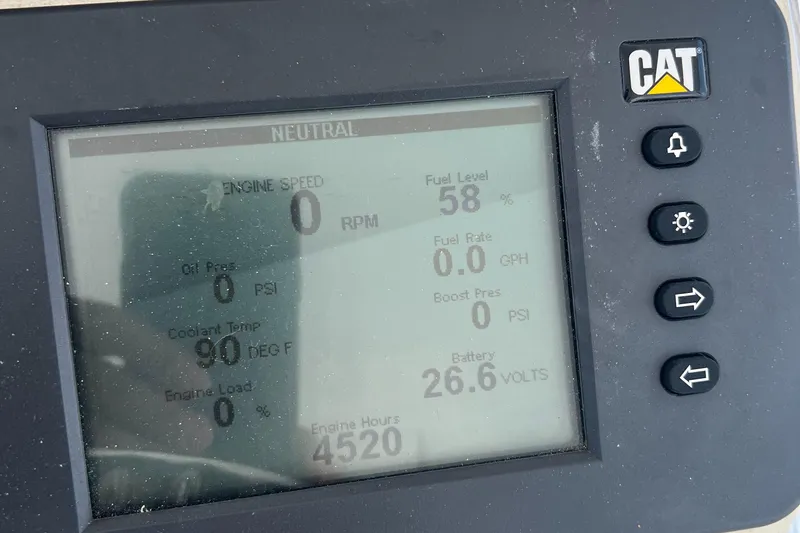 Slide: The Image of Cabo 40 Flybridge 2005 engine display showing fuel level, RPM, and battery voltage. - 33