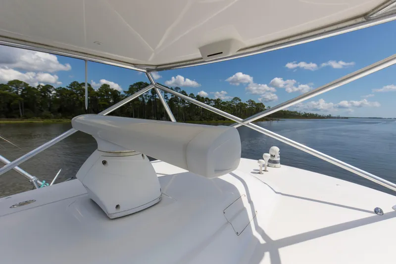 Slide: The Image of 2005 Cabo 40 Flybridge radar view with scenic water and forest backdrop. - 68