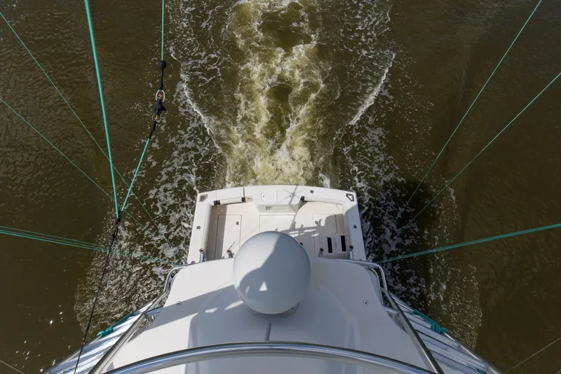 Slide: The Image of Aerial view of 2005 Cabo 40 Flybridge yacht navigating through water. - 71