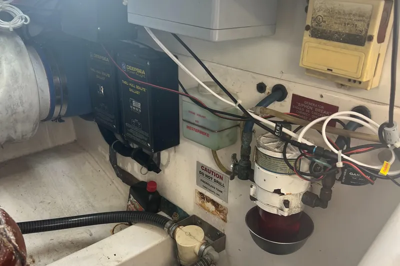 Slide: The Image of Engine room of 2005 Cabo 40 Flybridge with wiring and equipment. - 73