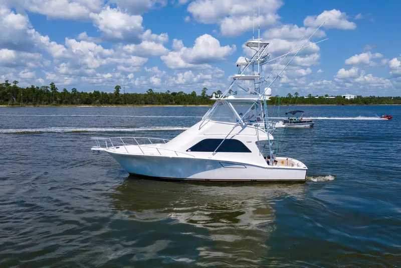 Slide: The Image of 2005 Cabo 40 Flybridge yacht cruising on a sunny day with blue skies. - 81