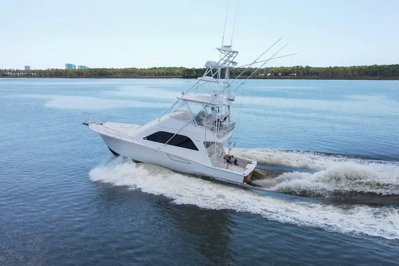 Slide: The Image of 2005 Cabo 40 Flybridge yacht cruising on calm waters. - 99