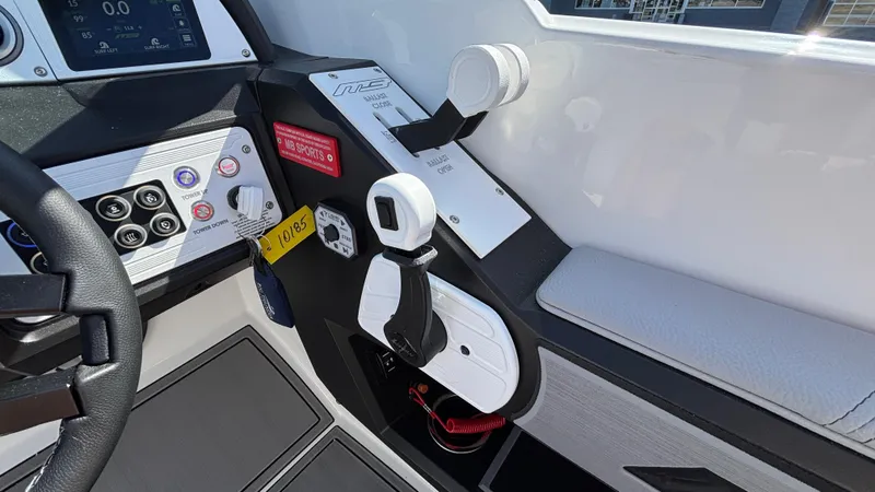 Slide: The Image of Control panel of MB B52 25 Alpha boat, 2025 model, featuring steering and throttle controls. - 13