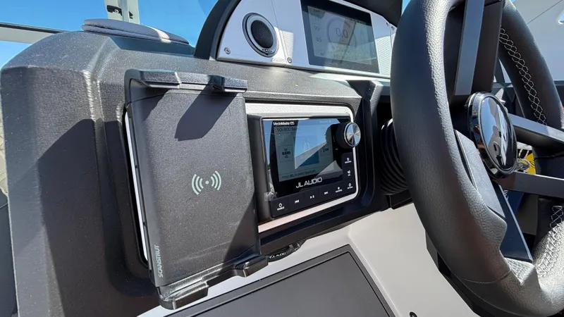 Slide: The Image of Dashboard of 2025 MB B52 25 Alpha boat with JL Audio system and steering wheel. - 14