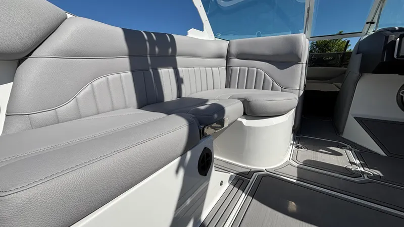 Slide: The Image of 2025 MB B52 25 Alpha boat interior with sleek gray seating and modern design. - 21